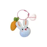 Маленький кролик с брелоком в виде морковки