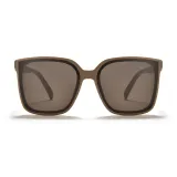 Молочно-чайная оправа с коричневыми линзами.