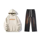 Комплект одежды (Абрикосовый топ + Черные джинсы)