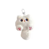 Белый плюшевый котенок