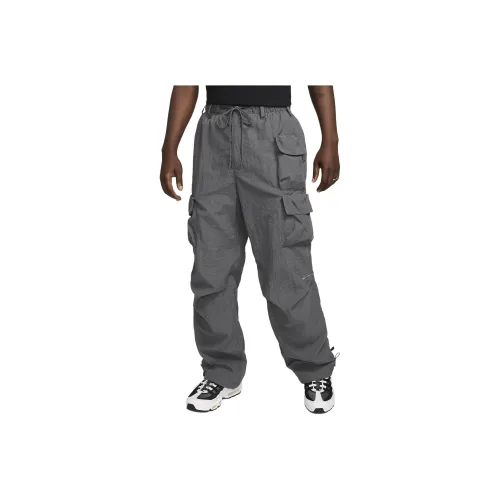nike SPORTSWEAR TECH PACK Повседневные брюки Мужской Железо Серый