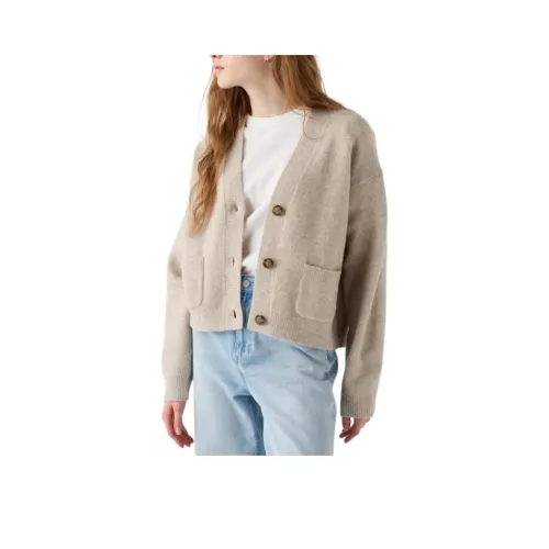 UNIQLO Бежевые Женские Свитеры