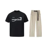 Чёрный топ + абрикосовые штаны