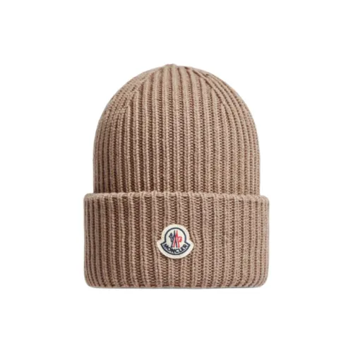MONCLER Шерстяные шапки унисекс бежевого цвета