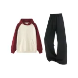 Абрикосовый топ с рукавами и черные штаны