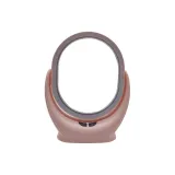 Розовое овальное зеркальце для макияжа