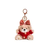 Плюшевый медвежонок цвета печенья с красным бантом