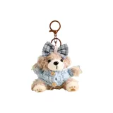 Плюшевый медвежонок цвета печенья с синим бантом