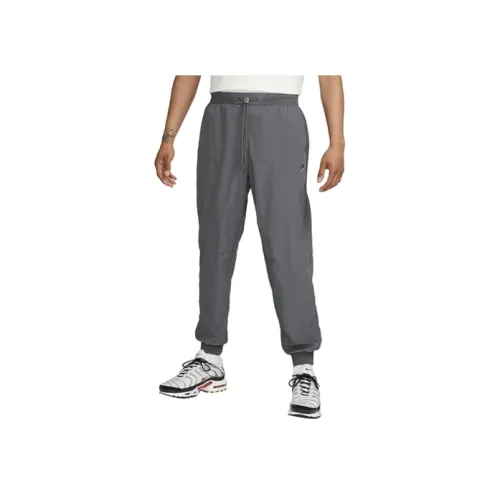 Nike SPORTSWEAR TECH PACK Серые Мужские спортивные брюки